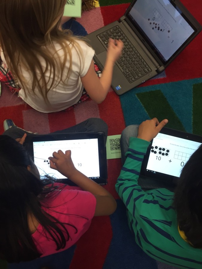 Students working on tablets