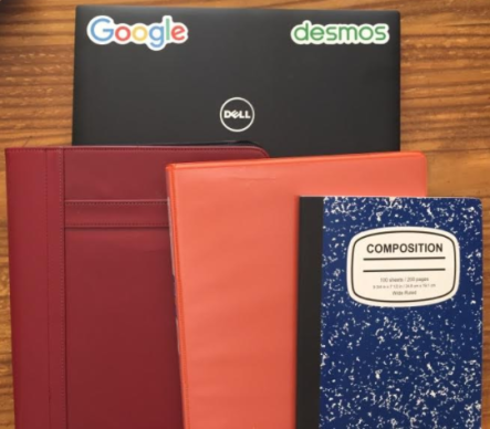 Picture of a computer, day planner, binder and a composition book